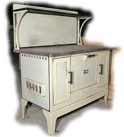 7-28: Round Oak Yellow Enamel Cookstove